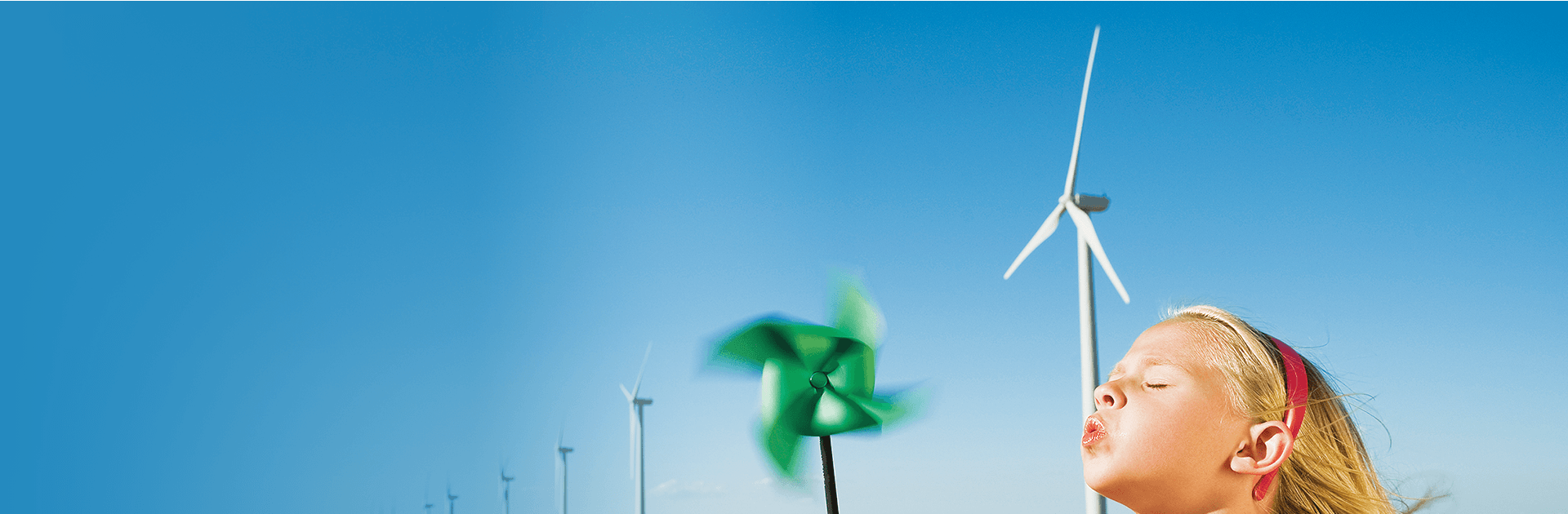 Girl with a toy windmill in her hand